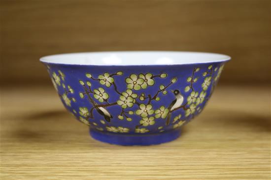 A Chinese blue ground prunus and blackbird bowl, bearing Qianlong mark to the base, diameter 14cm
